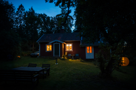 A home at dusk with lights on