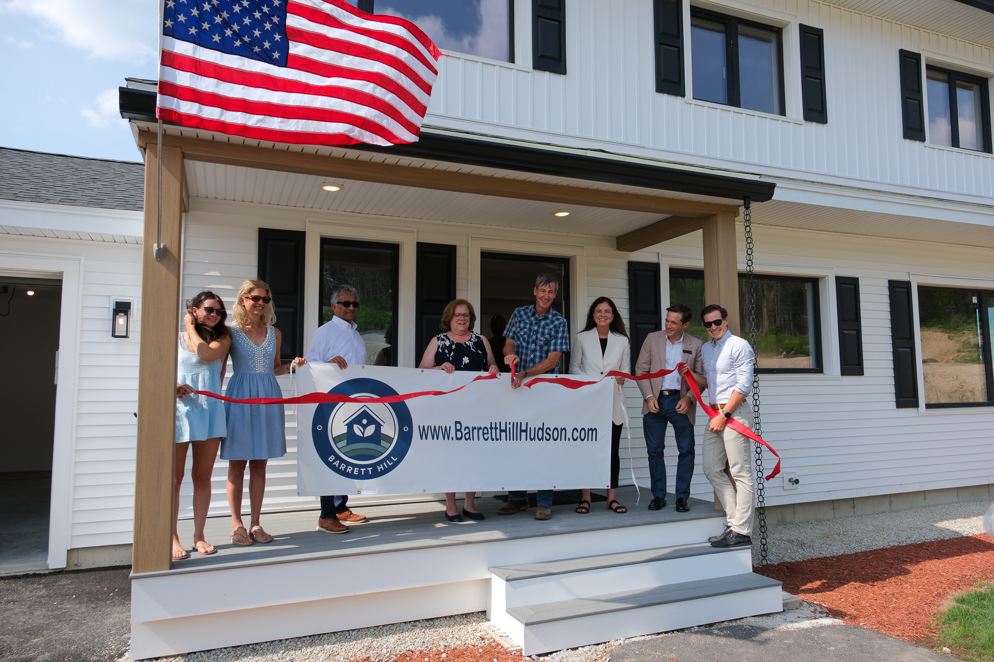 Eversource Vice President of Energy Efficiency and Electric Mobility Tilak Subrahmanian (third from left), project developers and other dignitaries at ribbon cutting for the Barrett Hill net zero subdivision on July 28.