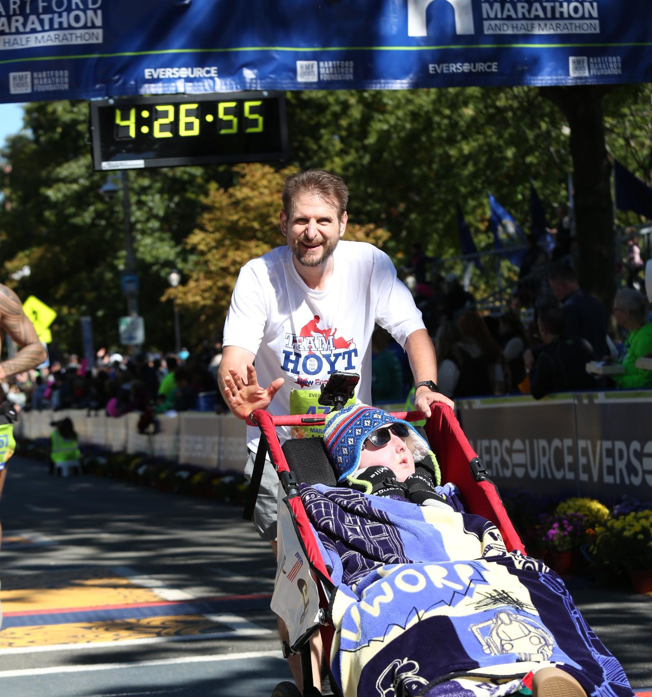 Dean and Keion Manley crossing the finish line at the Eversource Hartford Marathon in 2022.