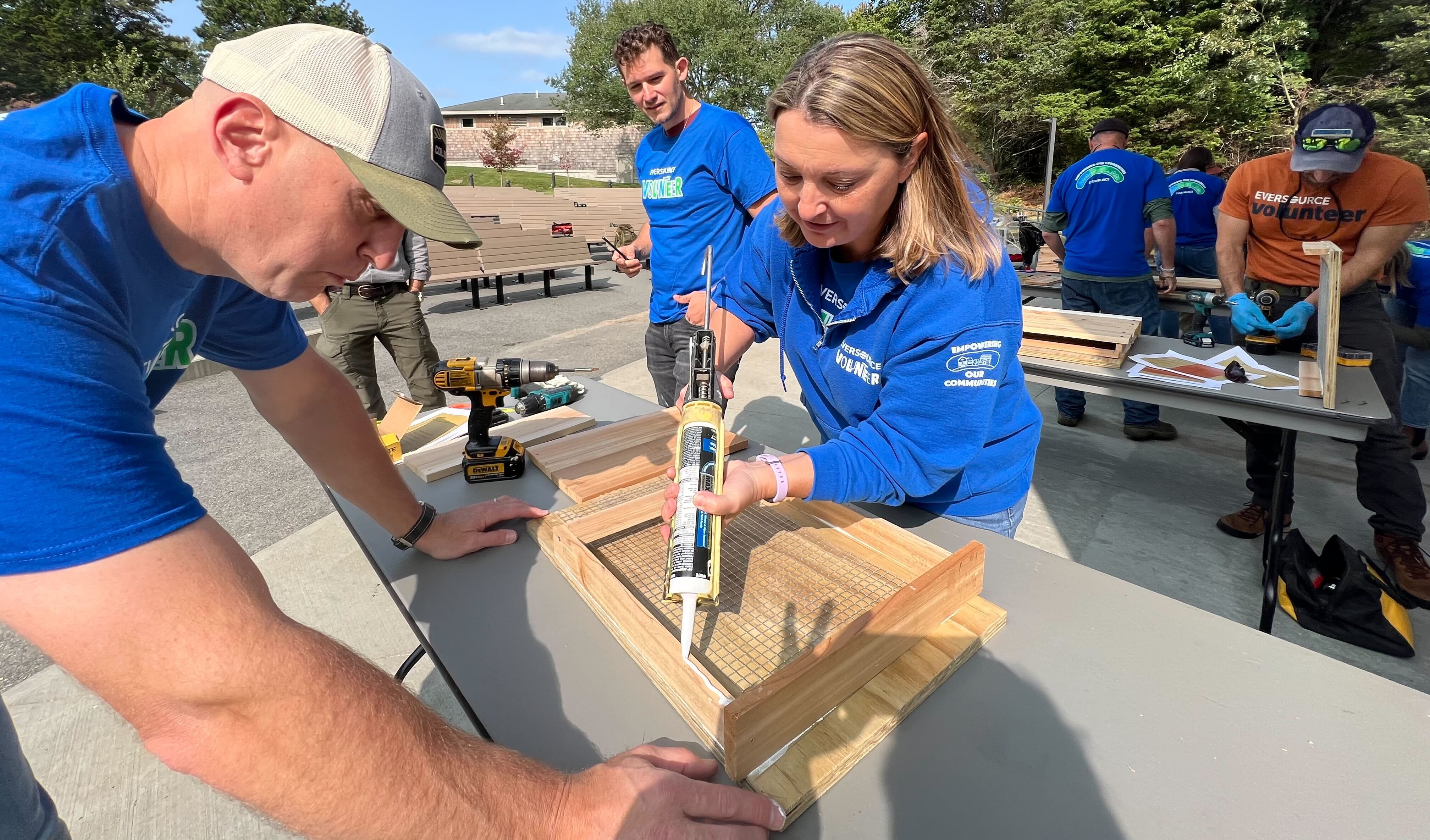 Eversource volunteers build a bat house.