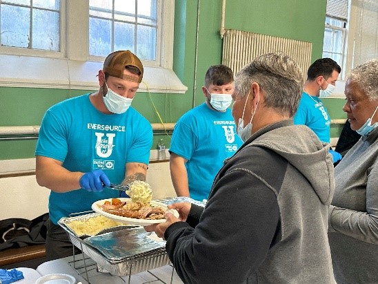 Eversource employees serving food