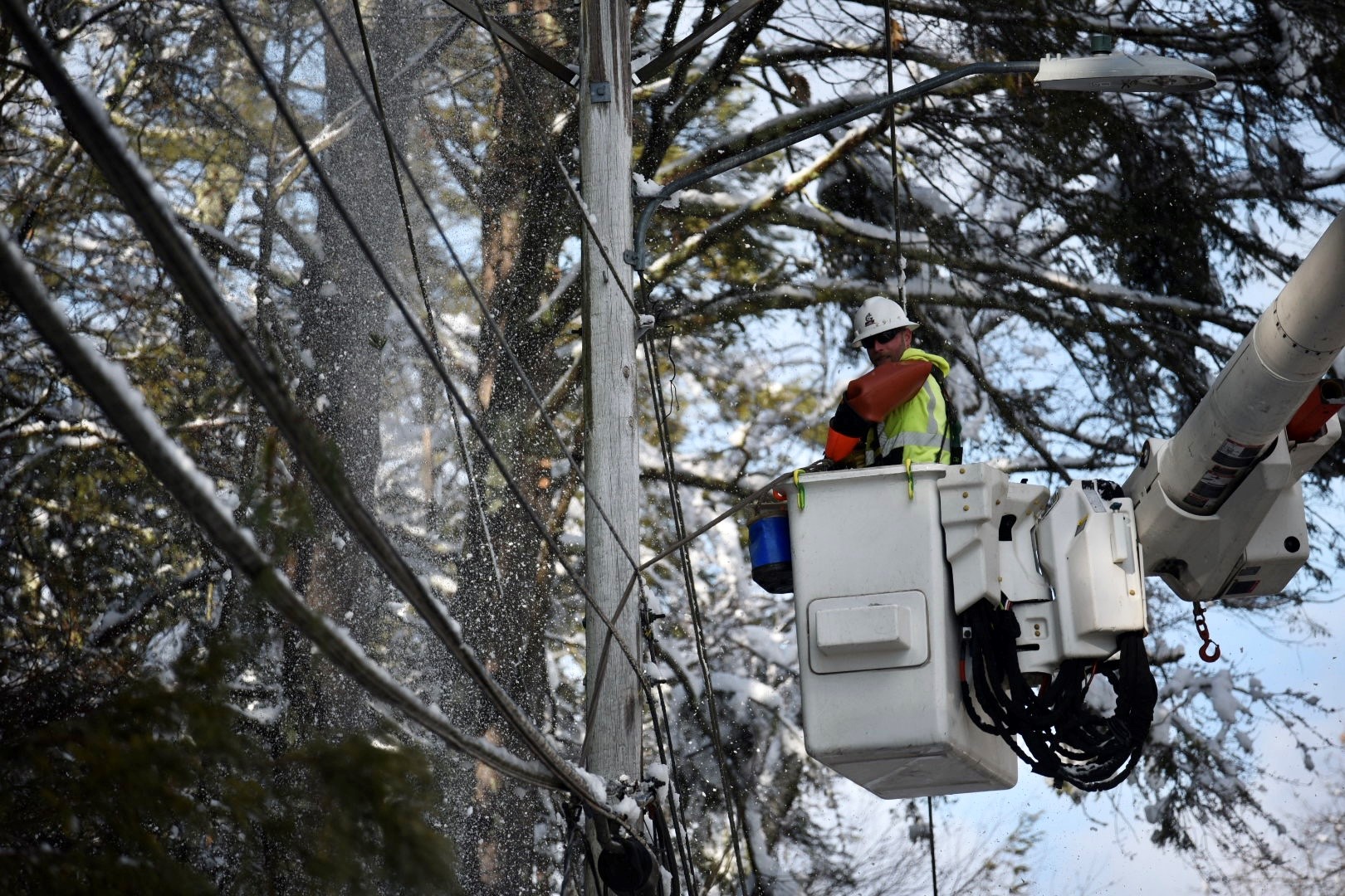 Lineworker working to restore power in Durham, New Hampshire.