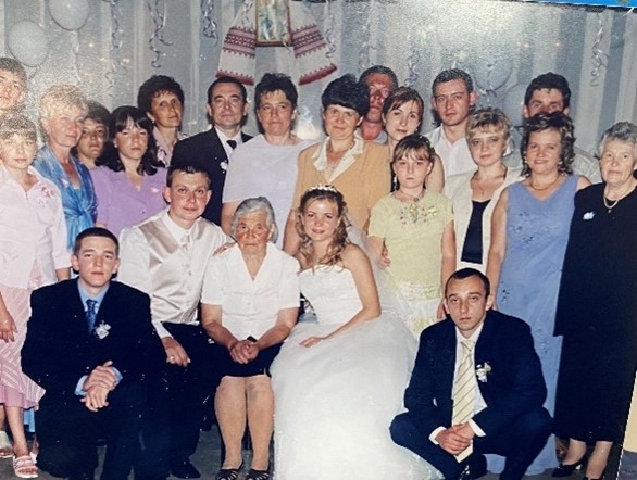 Stanislavskyy and his wife at their wedding in Ukraine. Some family members pictured remain in the country.