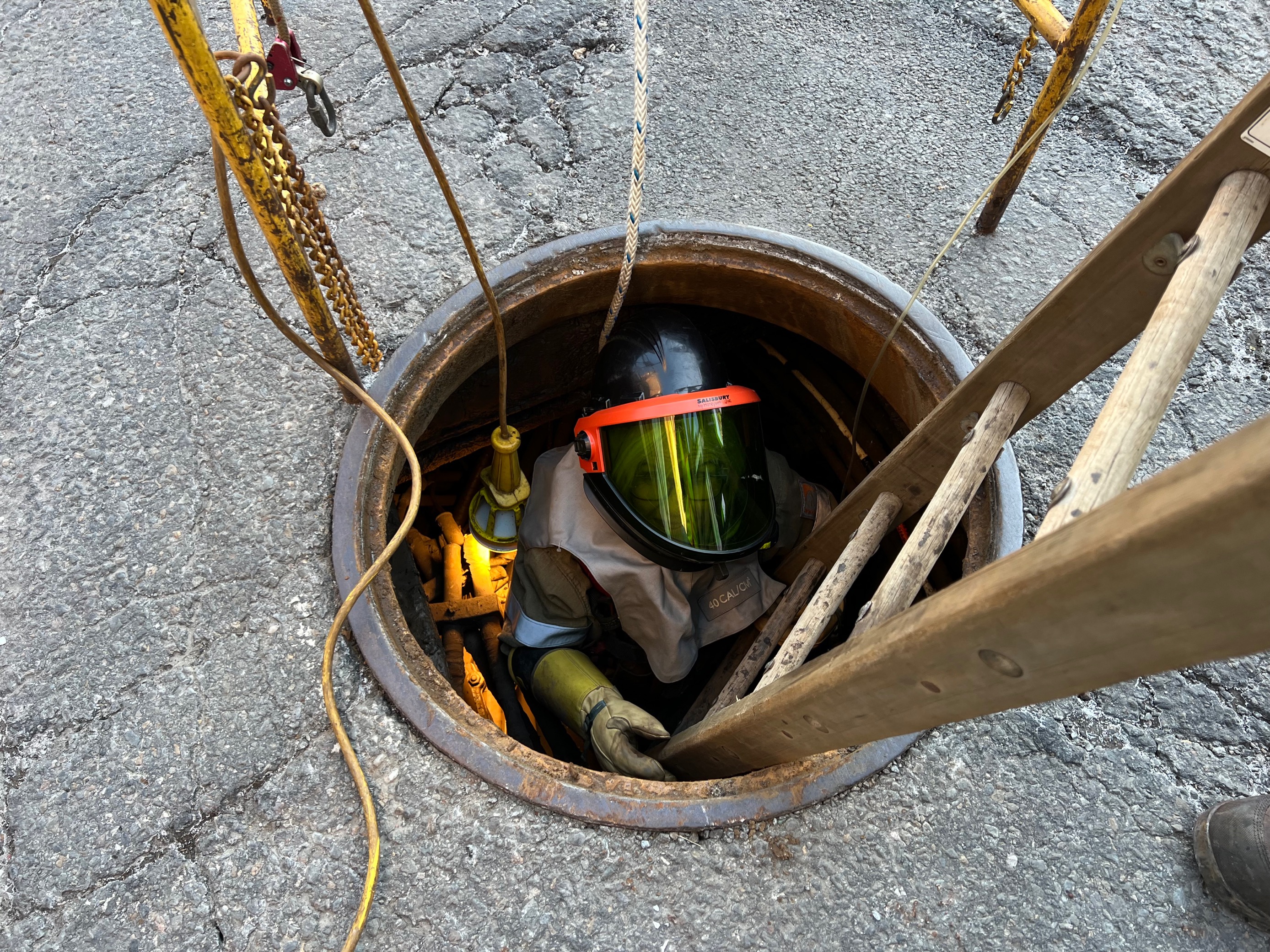 The sun rises over Tammy Pease as she works to help restore power to our customers in Downtown Boston during the final hours of her overnight shift as an Underground Apprentice Troubleshooter.