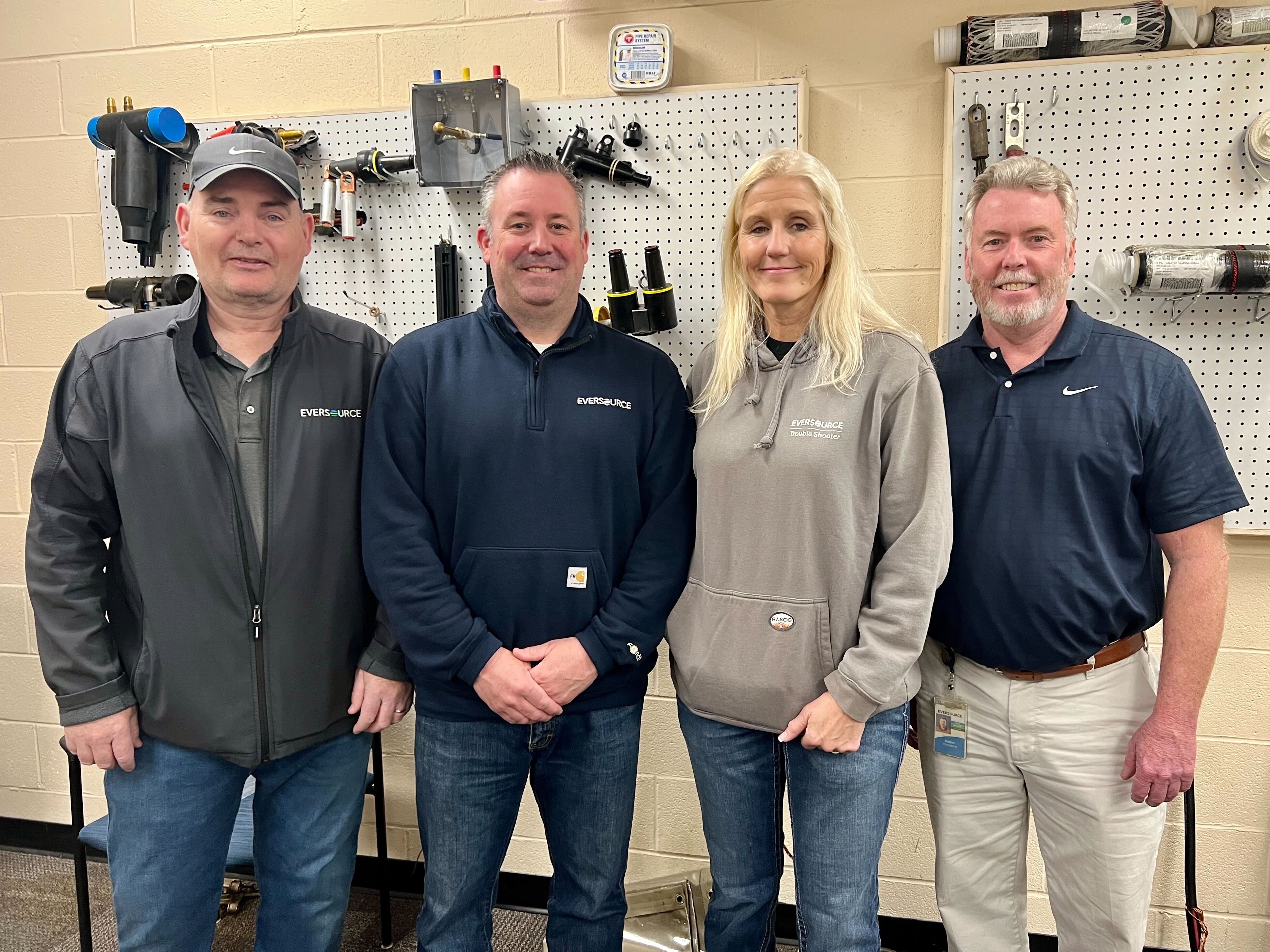 Electric Service Manager Tom Schlehuber, Electric Operations Director Mark Baldwin, and Electric System Operations Director Bob O’Loughlin joined Tammy and leadership from across the company to celebrate her historic achievement on April 14, 2022.
