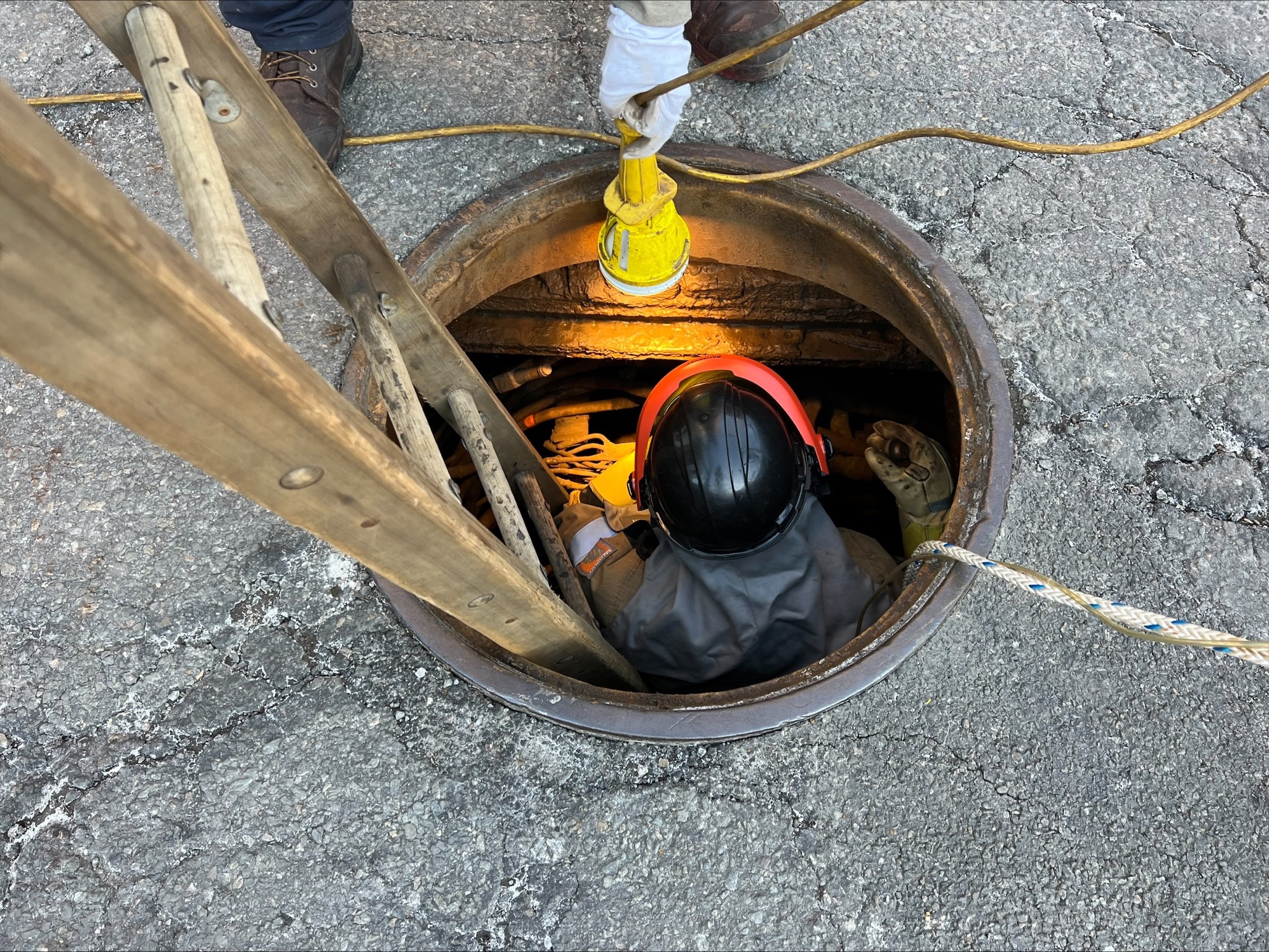 Pease works in a manhole in Downtown Boston.