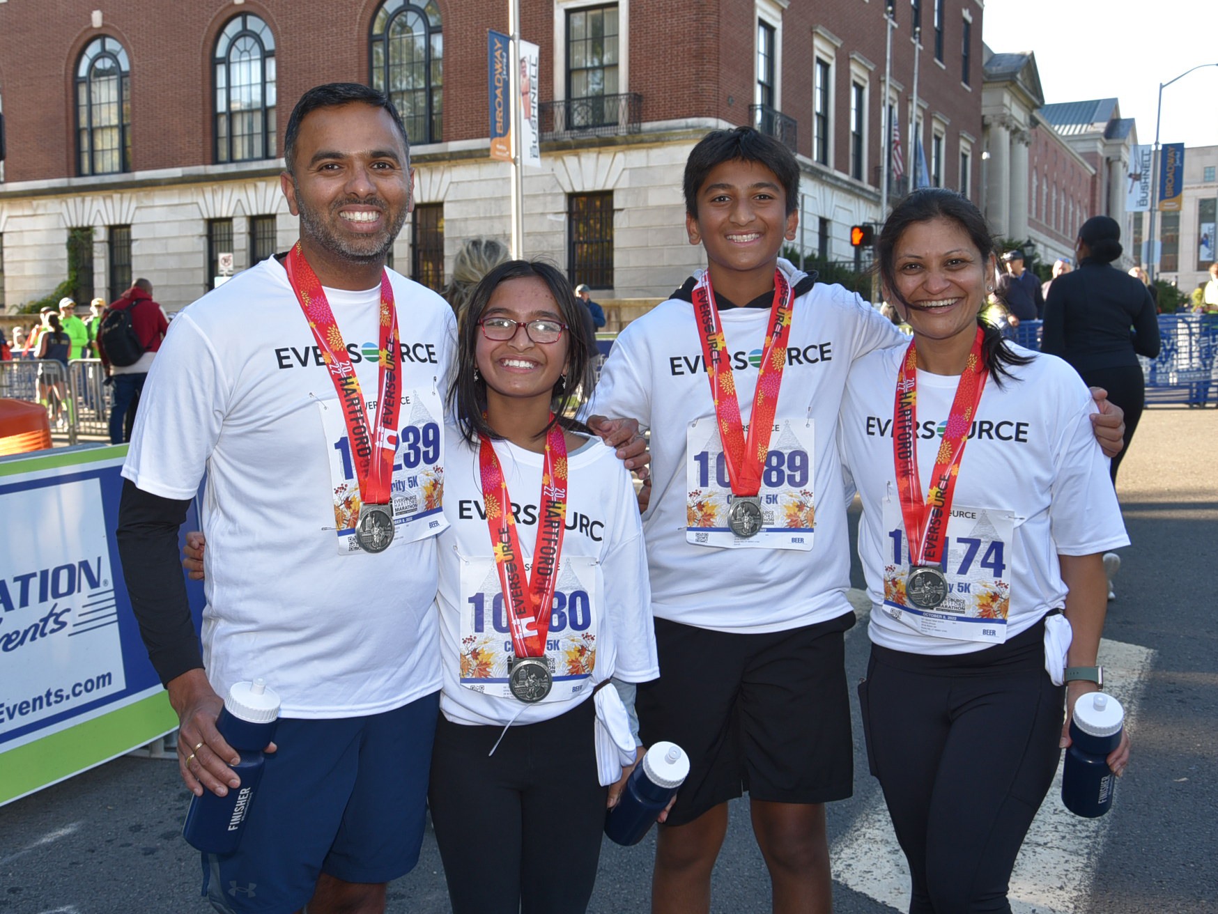 A smiling family with medals