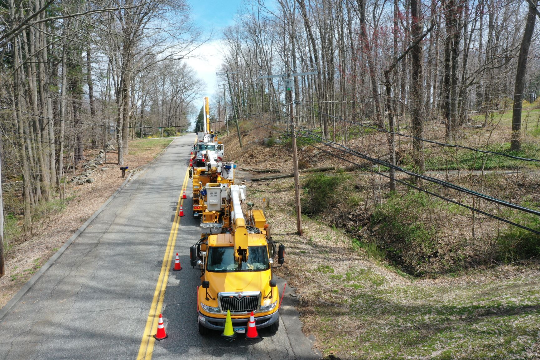 Eversource crews teamed up while maintaining social distancing to get the power back on in Columbia, Connecticut