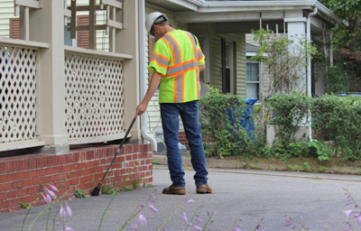 An Eversource employee inspecting a home.