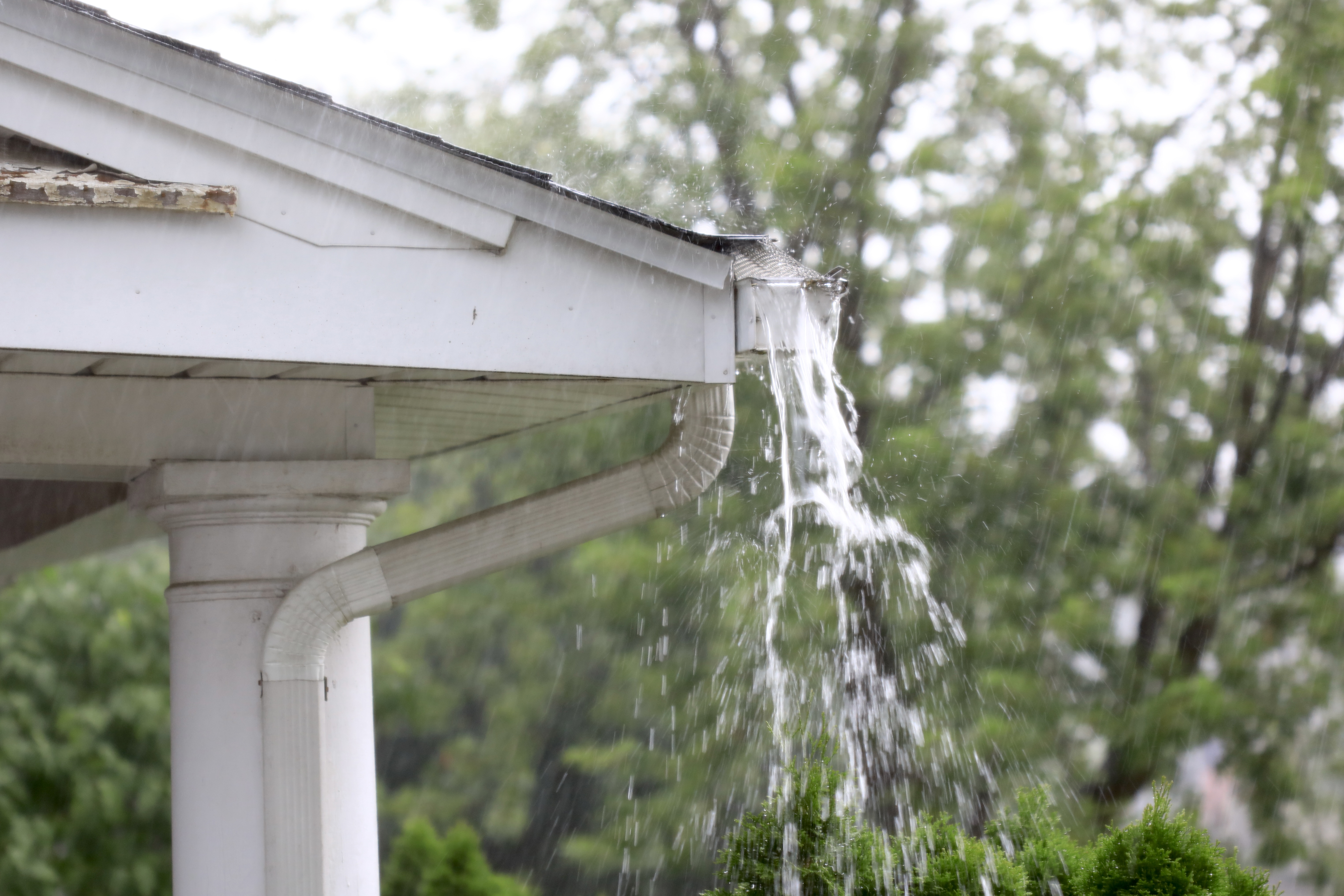 Heavy rain washing out a gutter