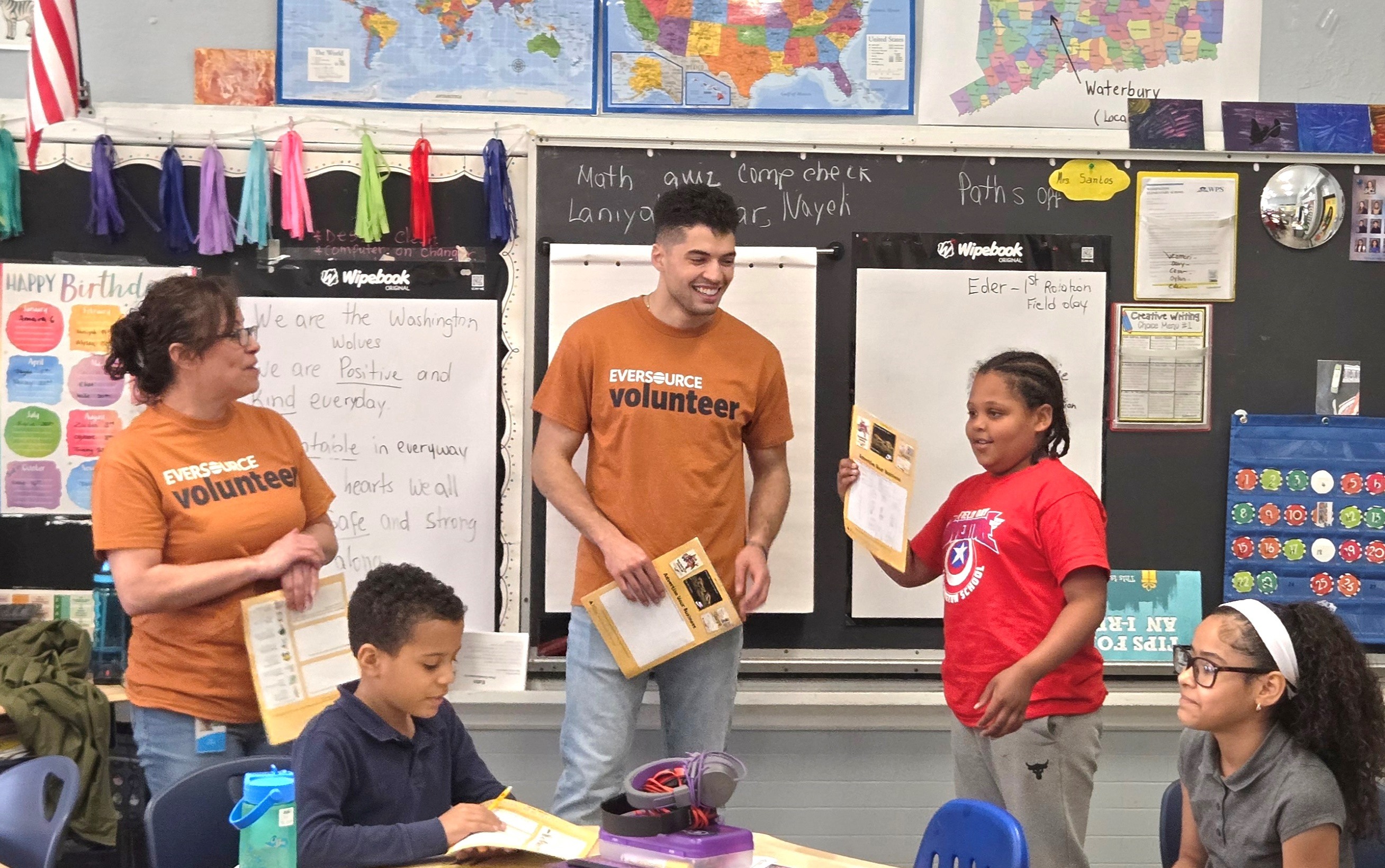 Employee volunteers joined the Junior Achievement (JA) staff at Washington Elementary School in Waterbury, Massachusetts, to present the JA in a Day educational curriculum to students in May 2025.