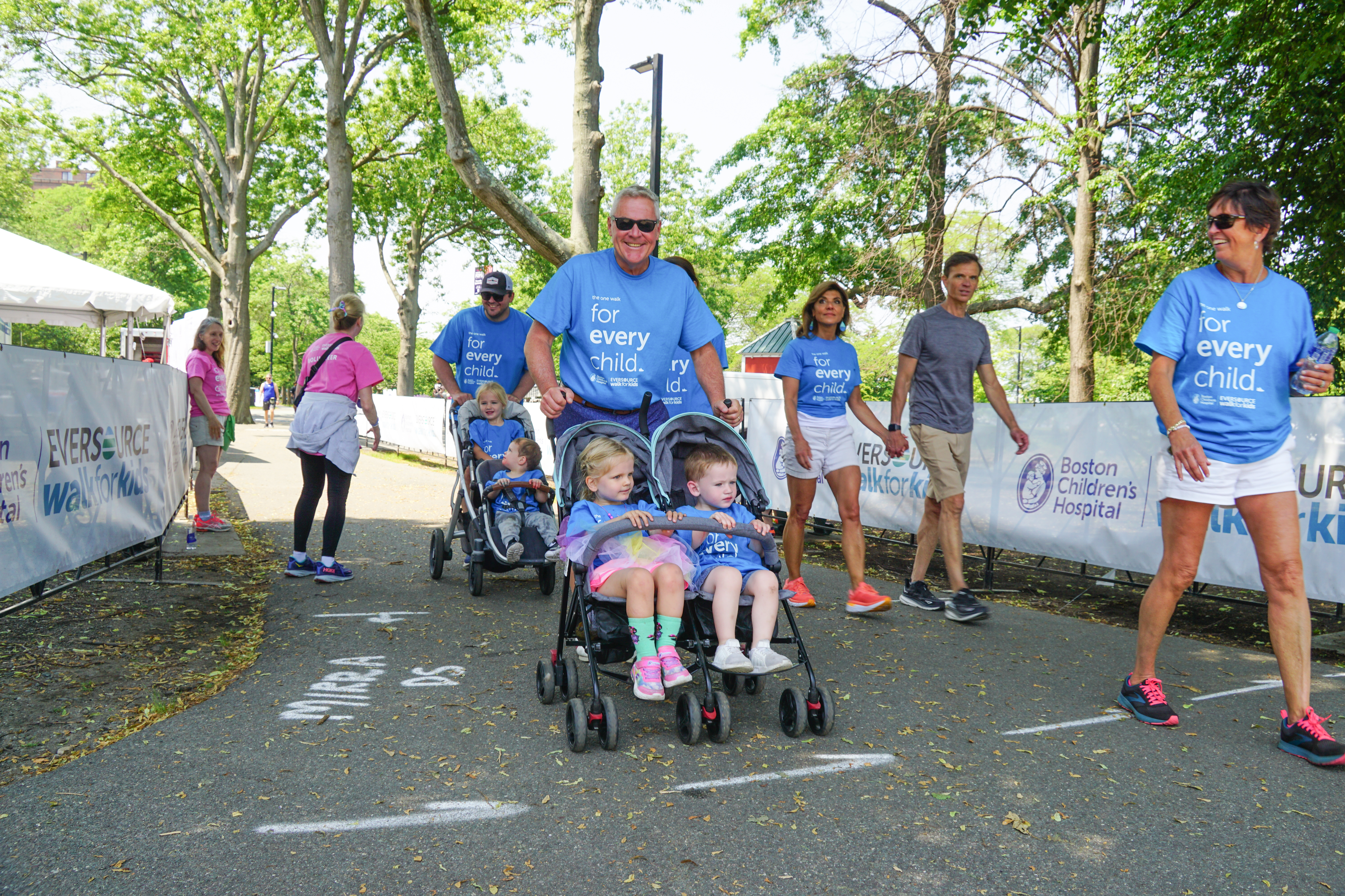 A smiling family walking 