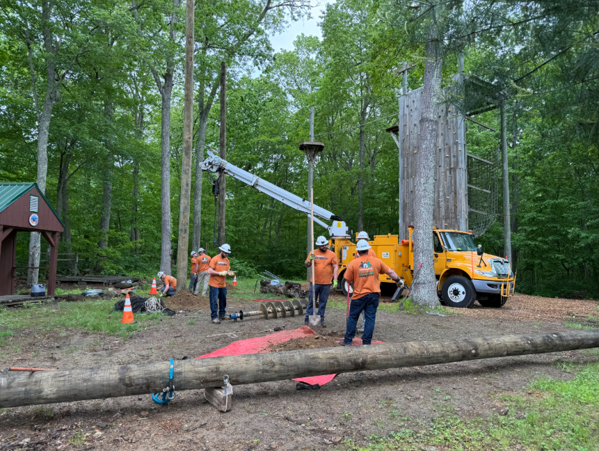 Eversource volunteers assist at the June Norcross Webster Scout Reservation Camp as part of Scouting America's Day of Caring.